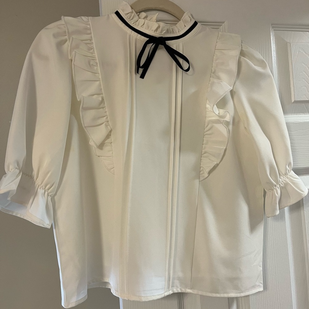 Chic Cream Blouse with Black Ribbon Accent